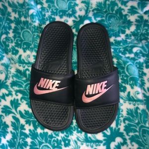 Rose gold and black nike slides